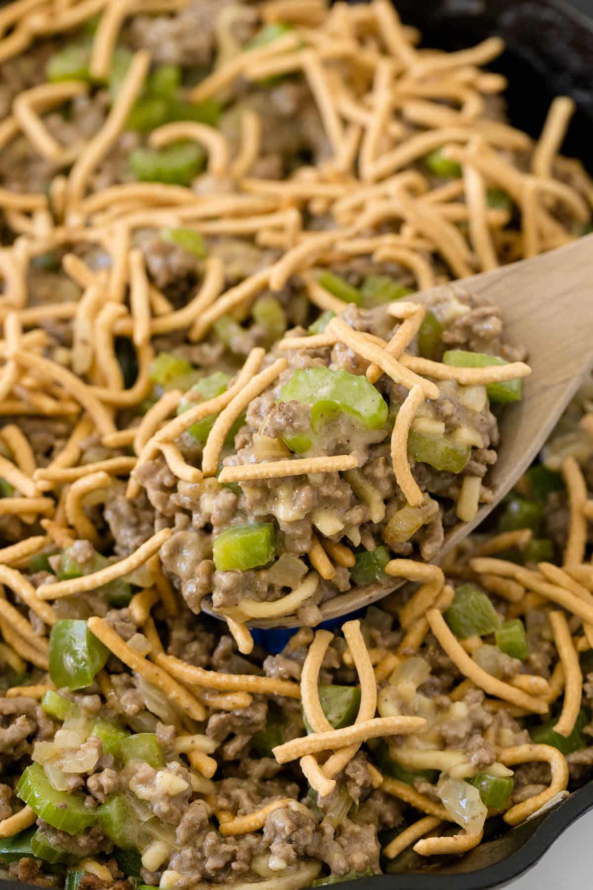 Chow Mein Skillet in a pan with a wooden serving spoon.