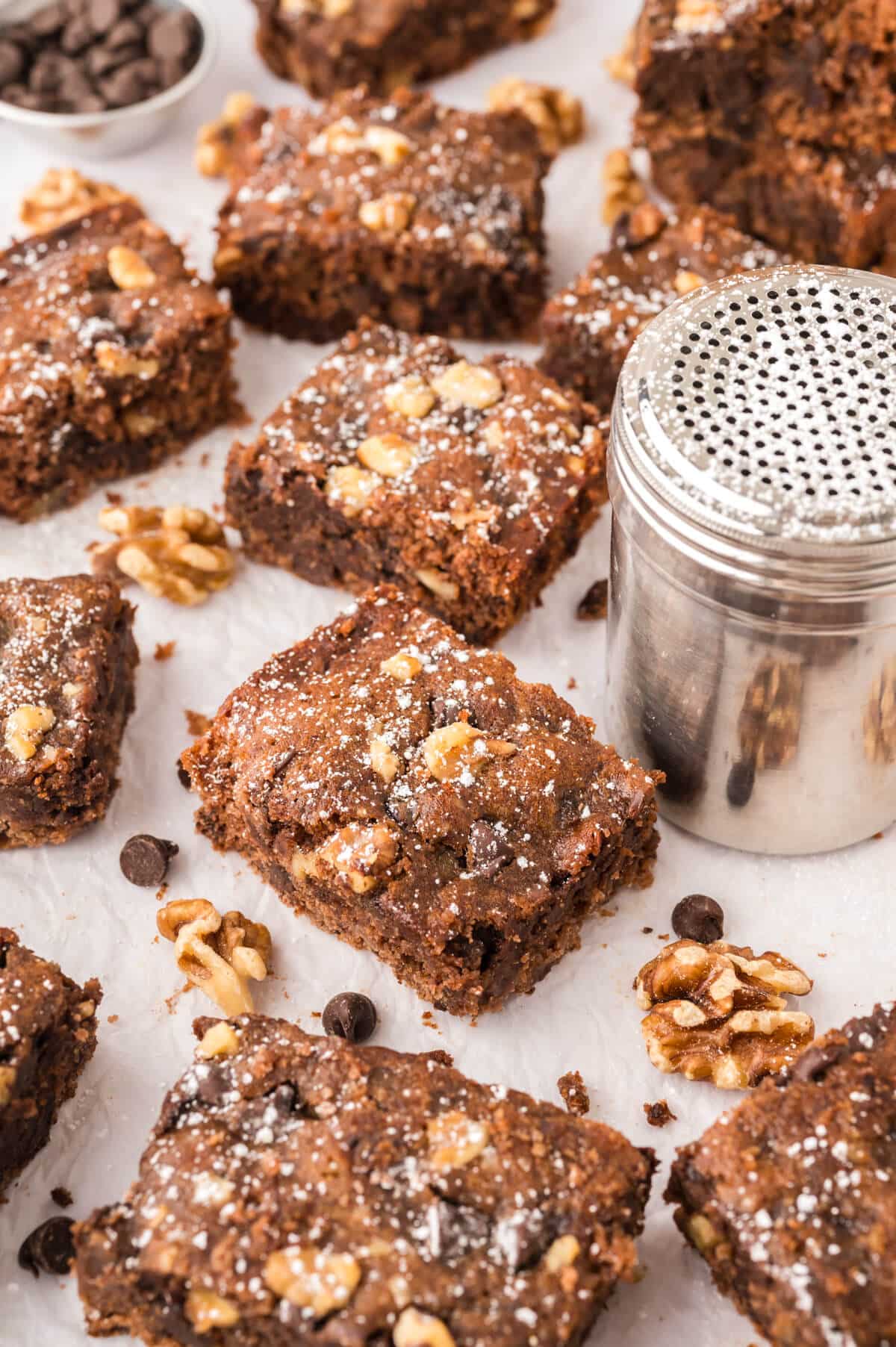 Chocolate surprise bars on a counter with a powdered sugar container.