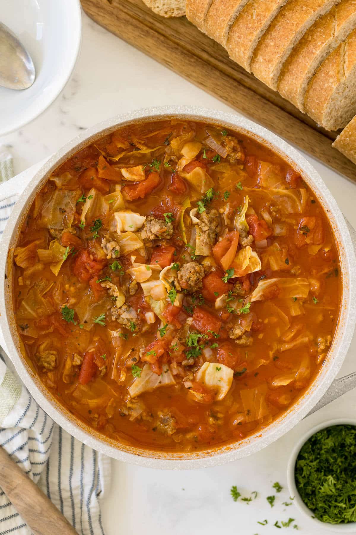 Sausage and cabbage soup in a pot.