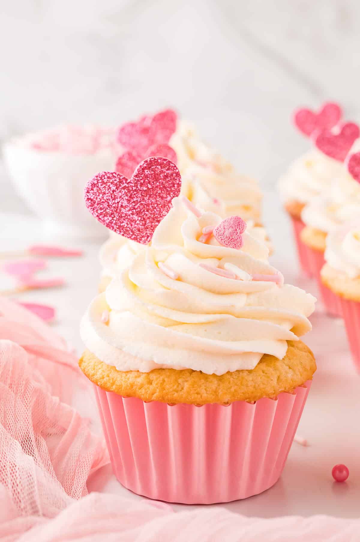 Valentine's day cupcakes on a white surface.