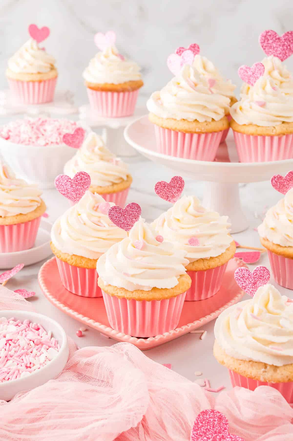 Valentine's day cupcakes on heart plate.