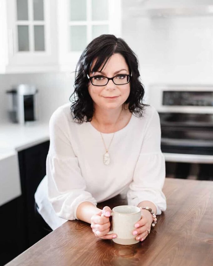 Stacie, author of Simply Stacie, standing in kitchen.