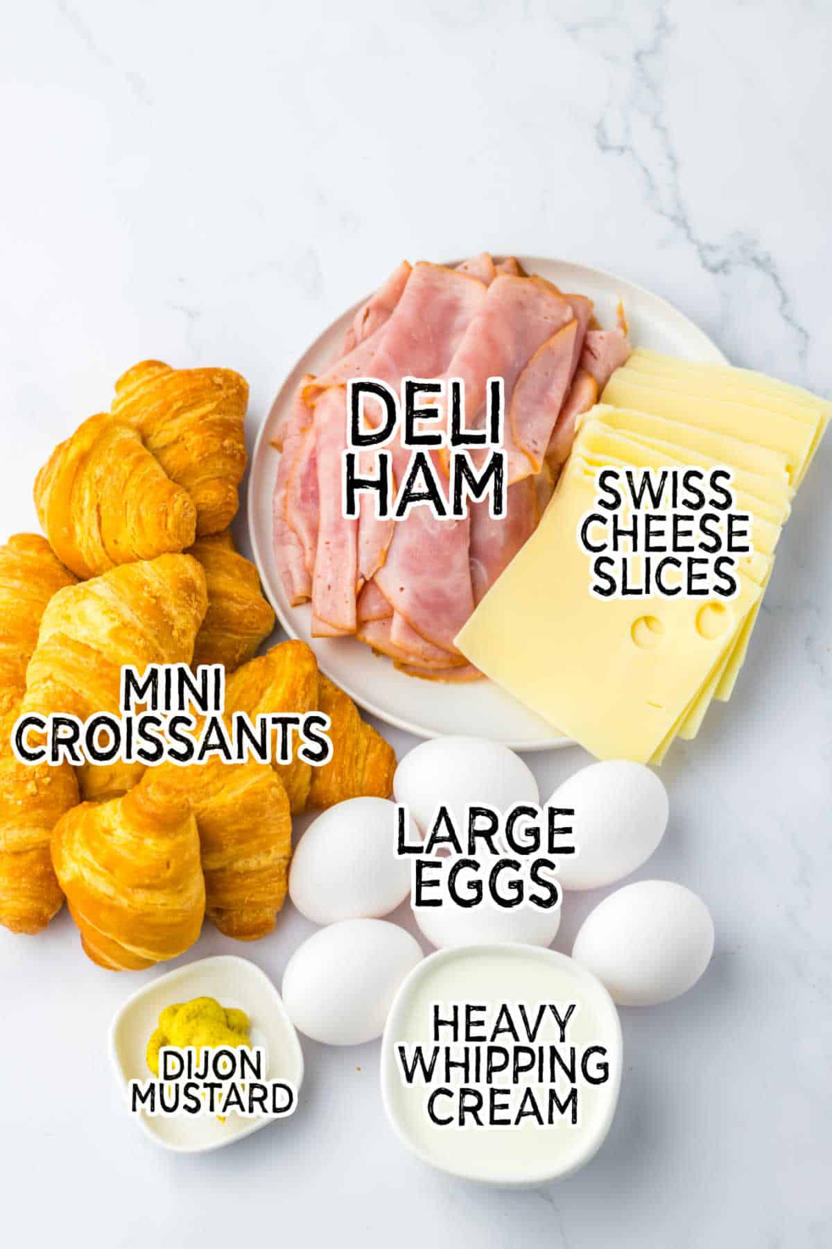 Ingredients on a white marble counter.