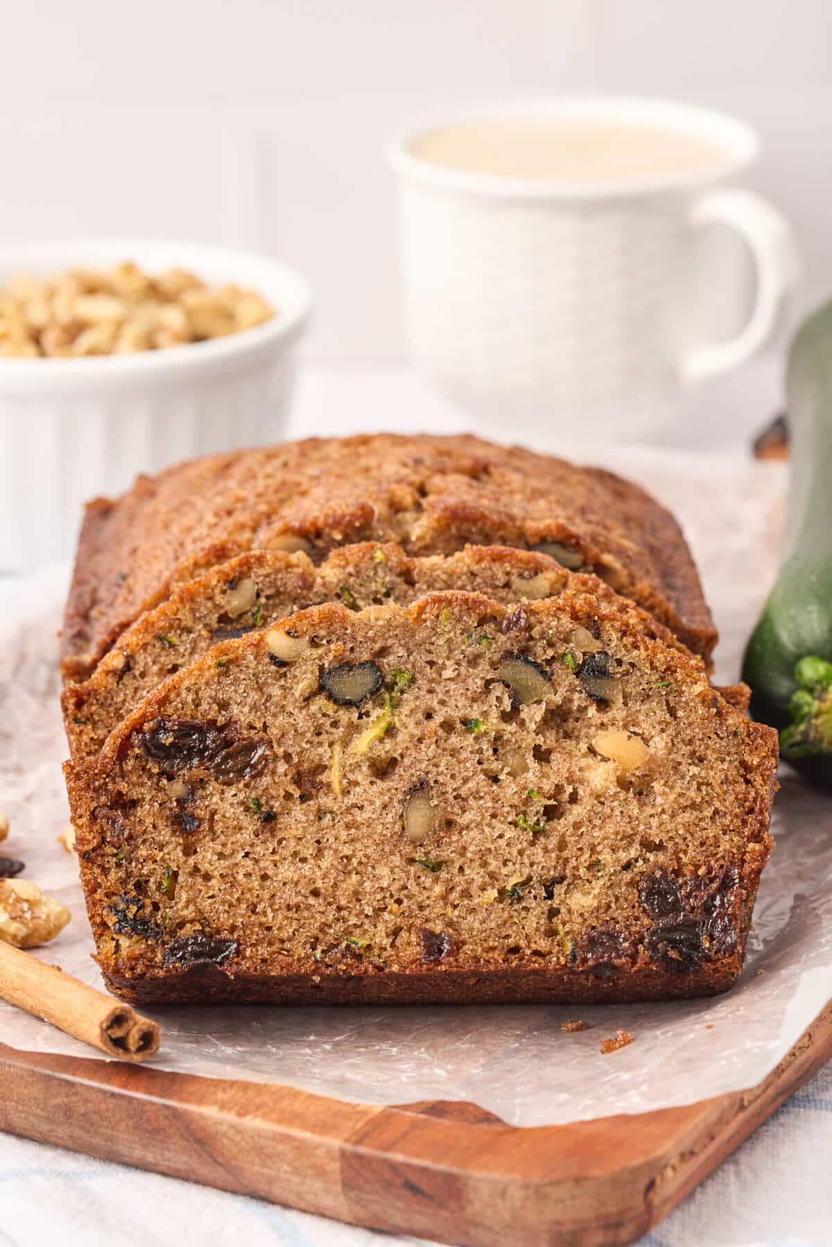 Slices cut off a loaf of zucchini bread.