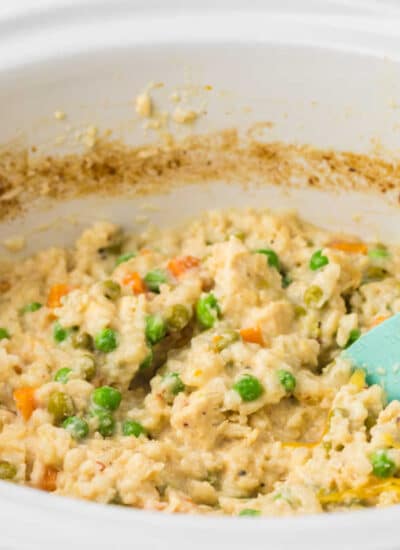 The recipe in a crockpot with a wooden spoon.