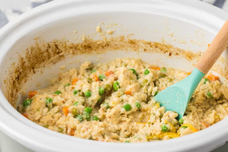 The recipe in a crockpot with a wooden spoon.