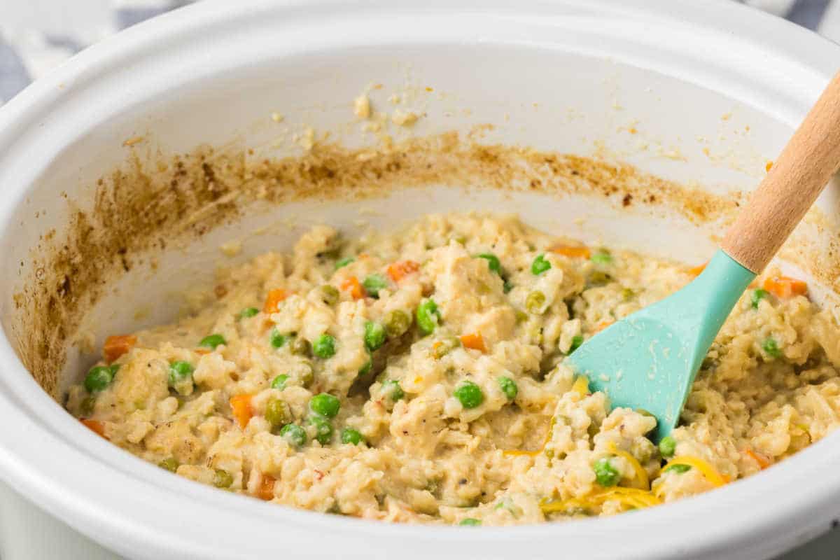The recipe in a crockpot with a wooden spoon.