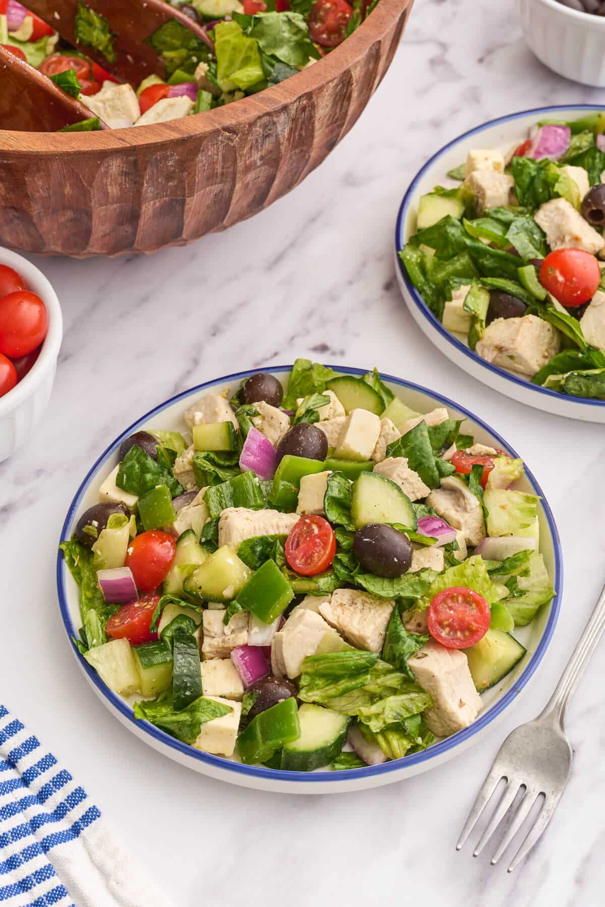 Greek chicken salad on a plate.