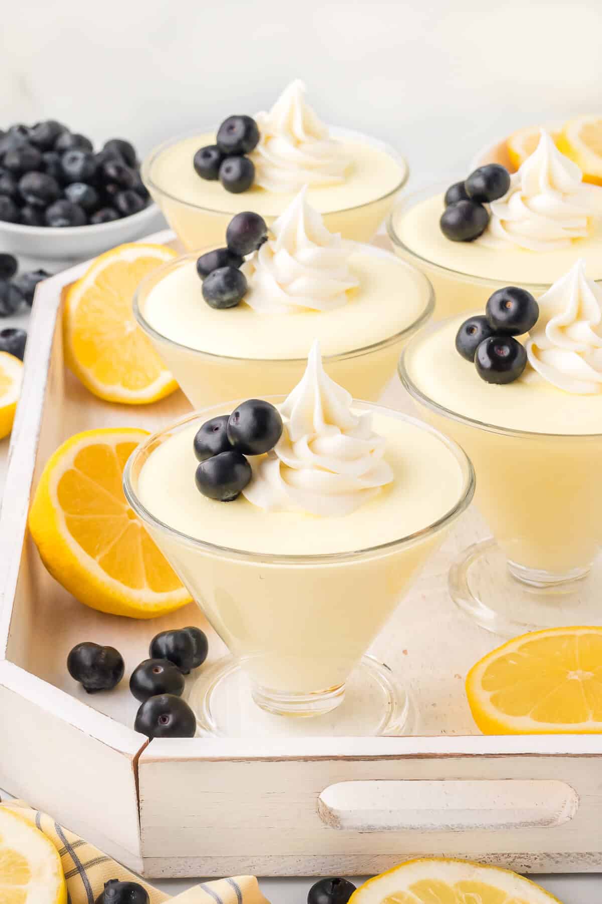 A group of lemon cheesecake mousse on a tray.