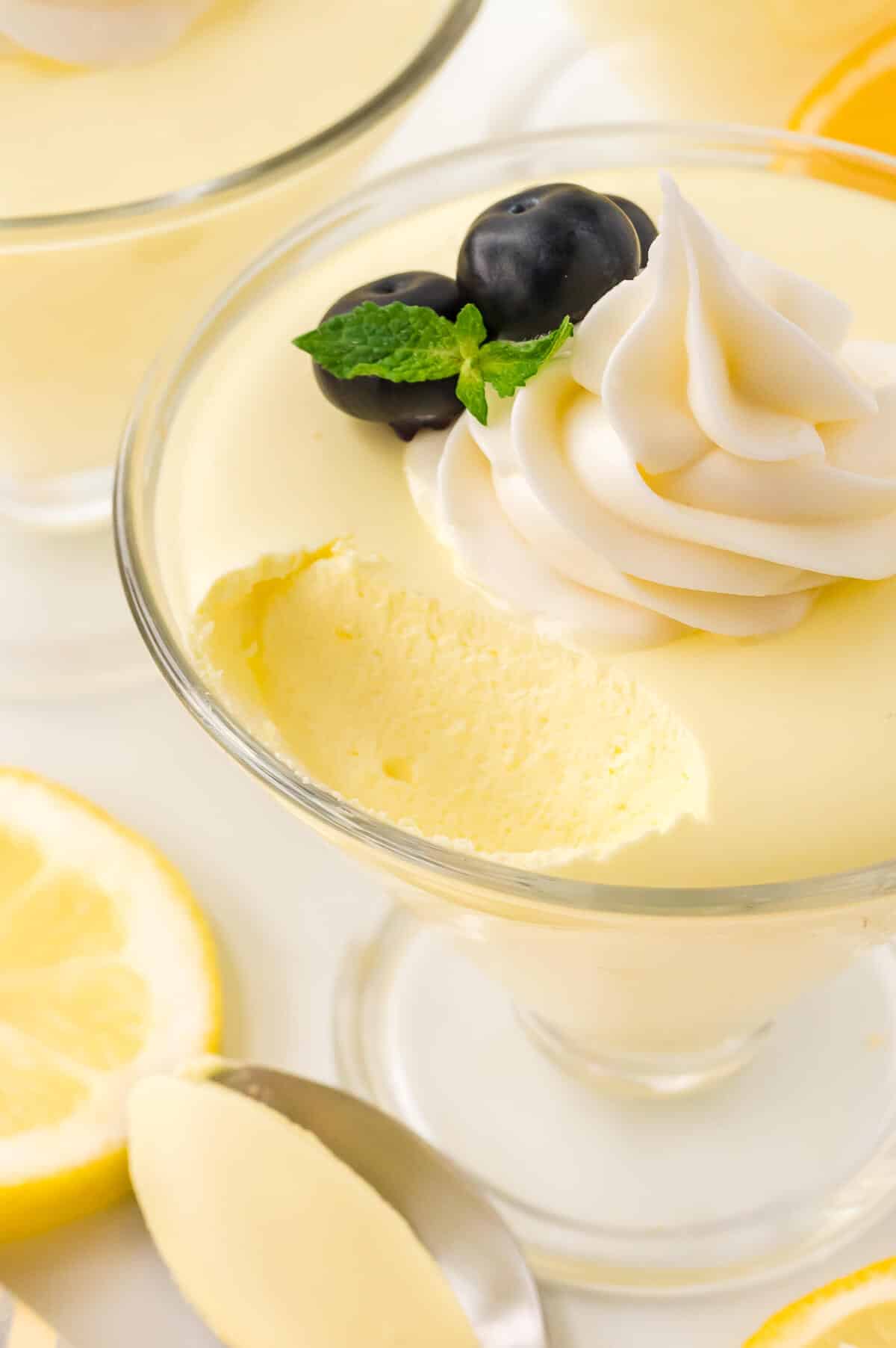 Lemon cheesecake mousse with a bite out of it.