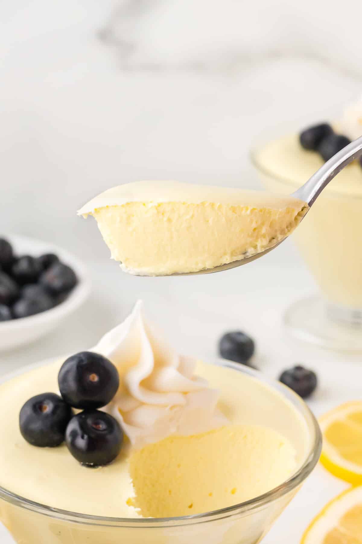 Lemon cheesecake mousse on a spoon.