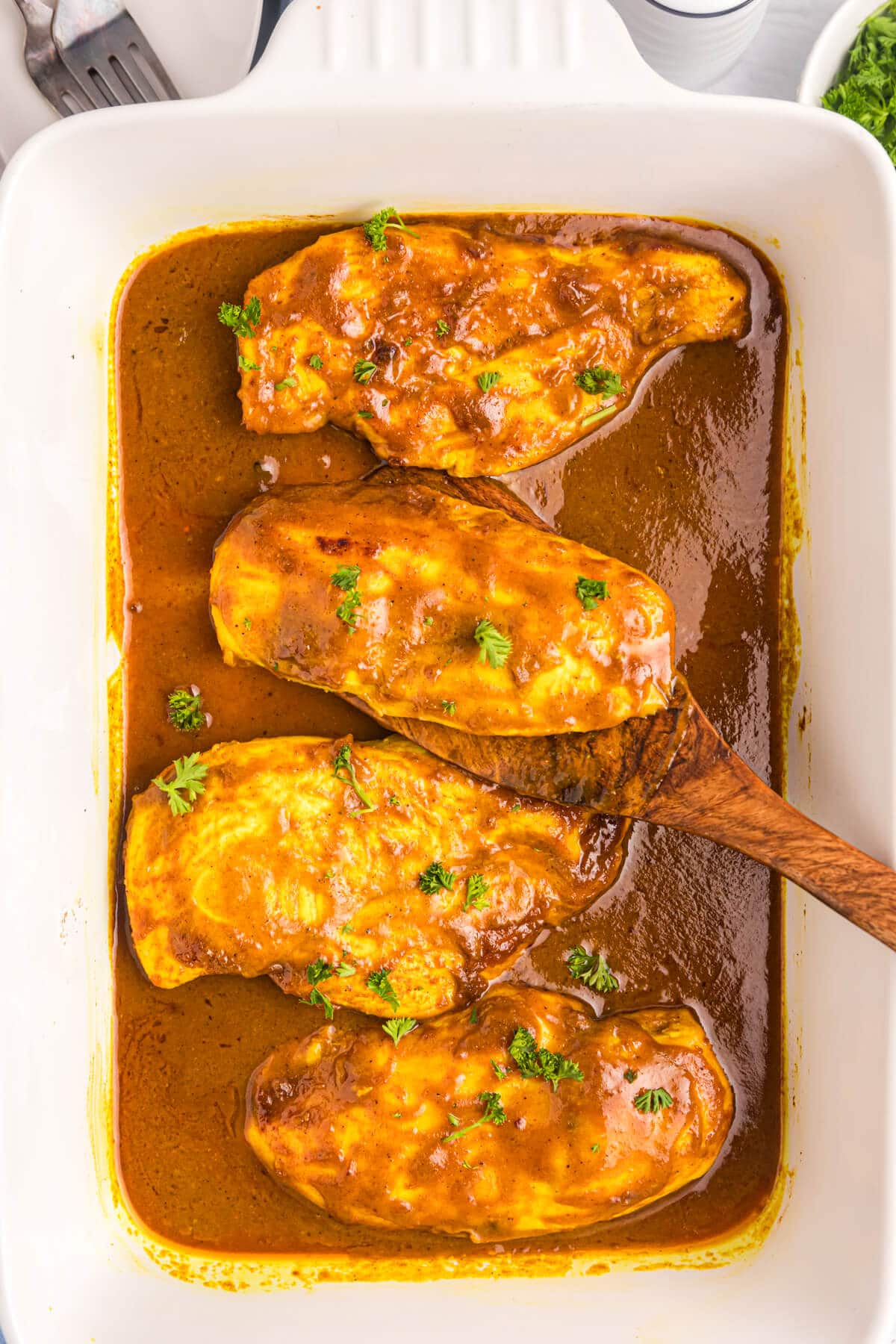 Honey curried chicken in a pan.