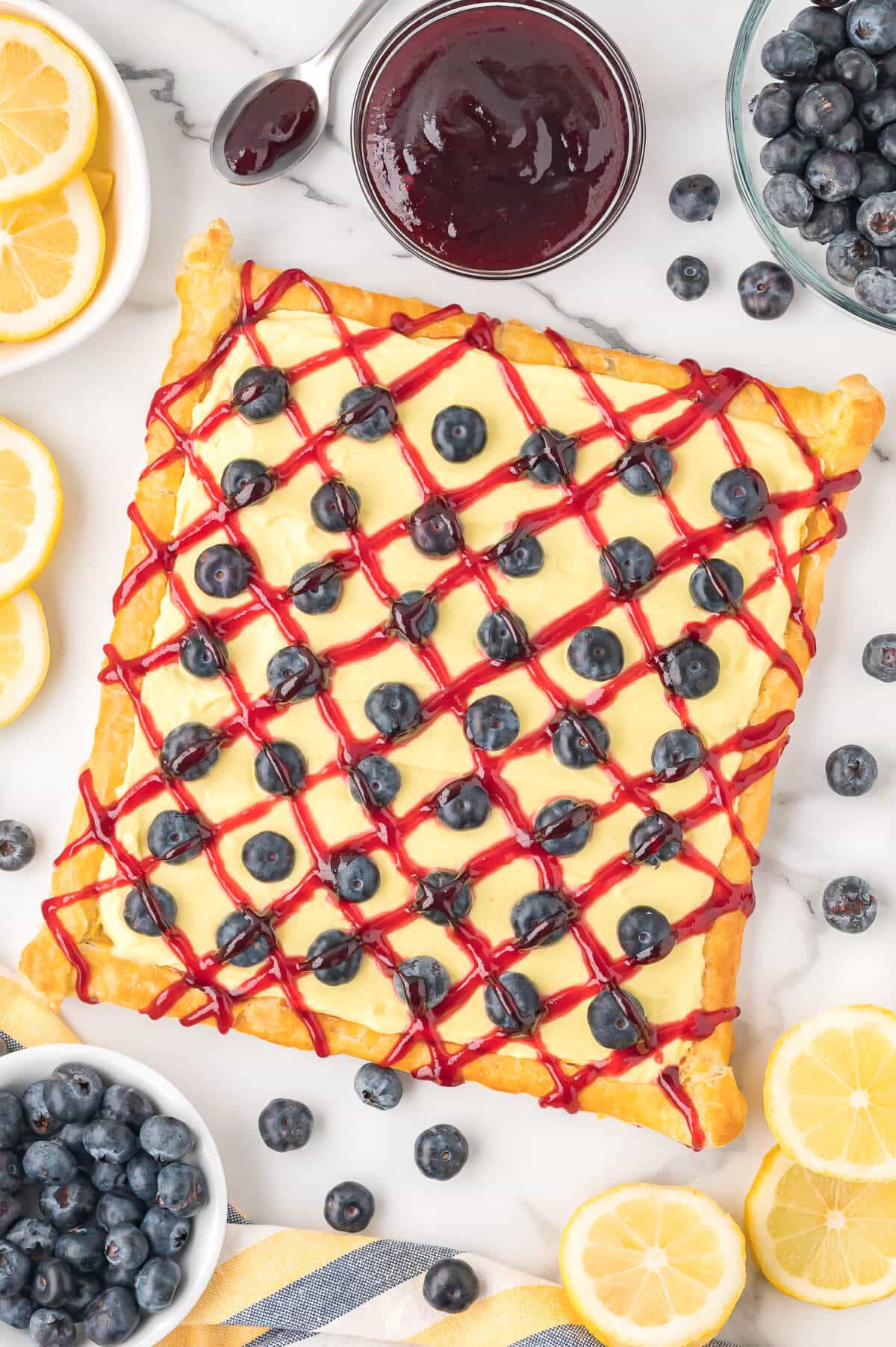 Blueberry lemon tart surrounded by ingredients.