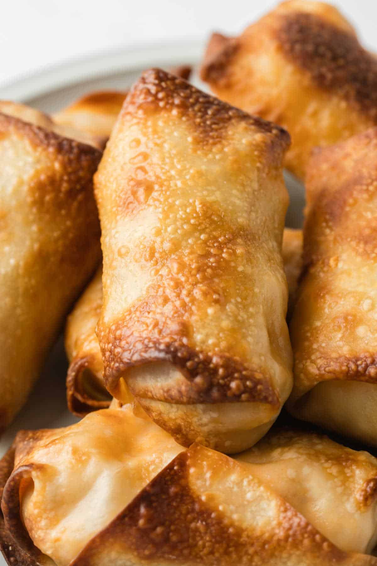 A group of buffalo chicken egg rolls.