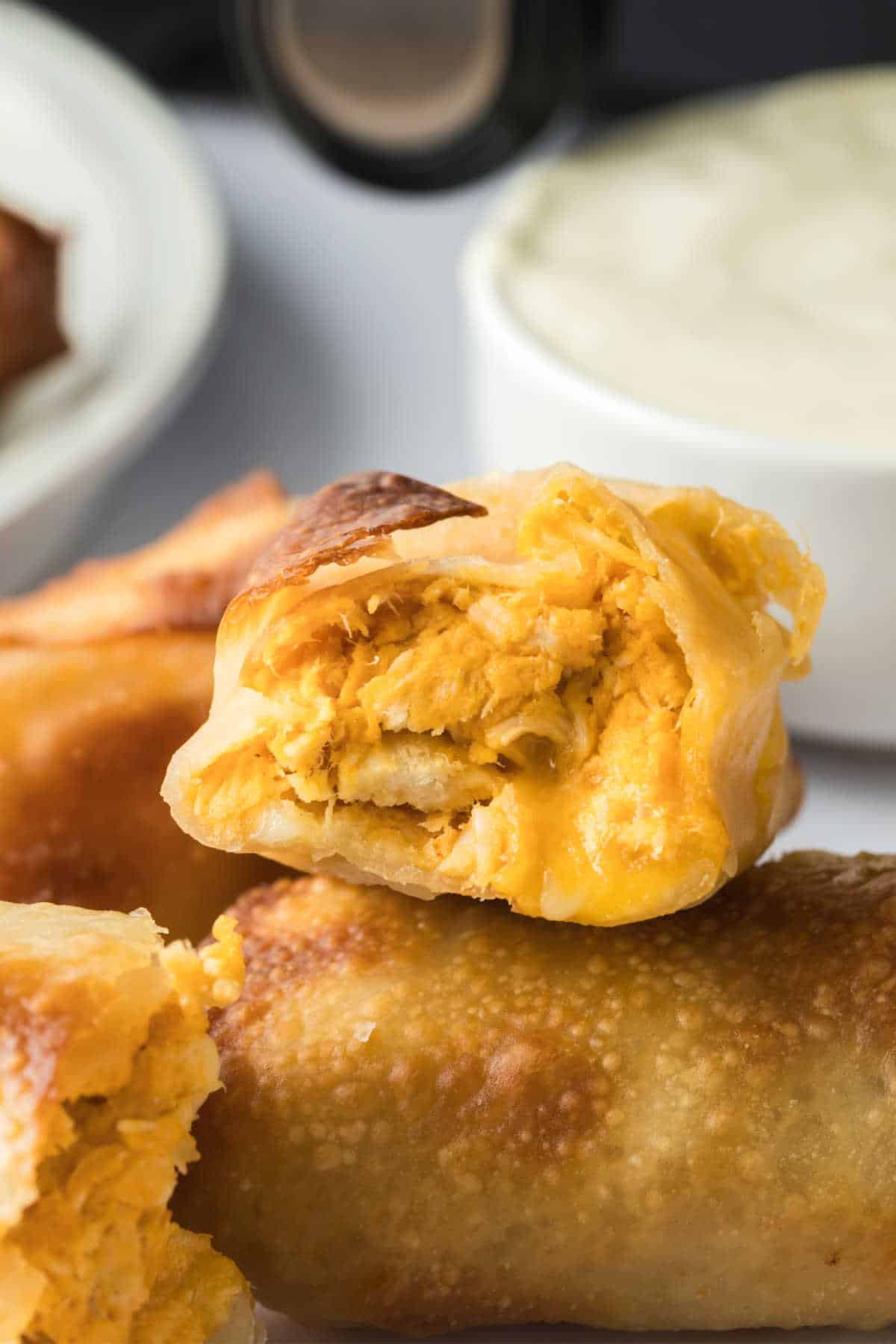 A buffalo chicken egg roll cut in half.