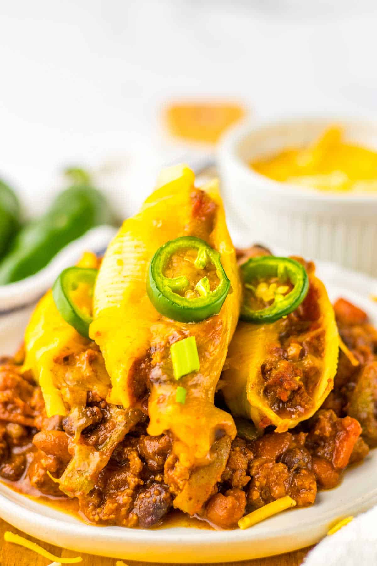 Chili cheese stuffed shells on a plate.