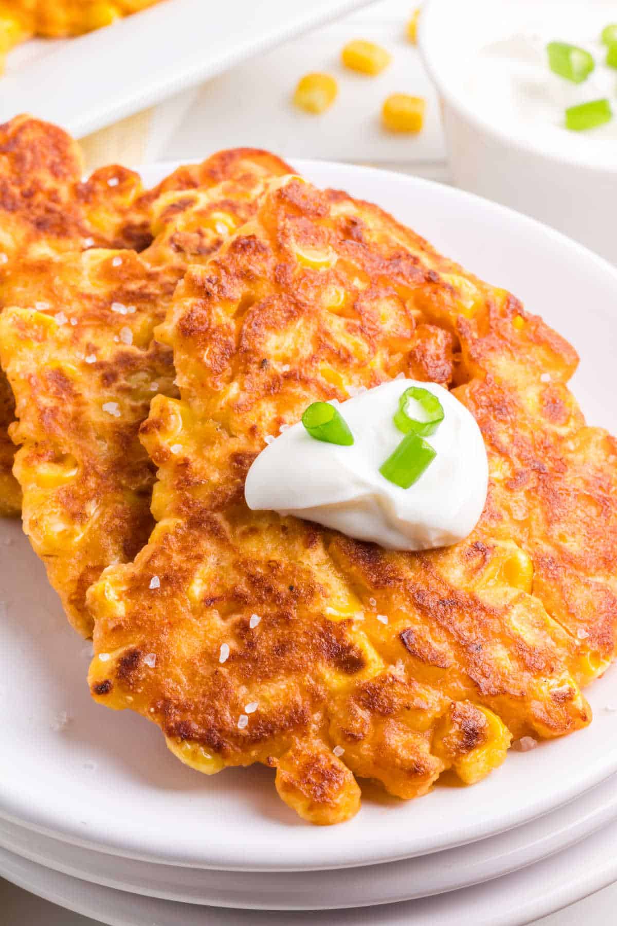 Corn fritters on a plate.