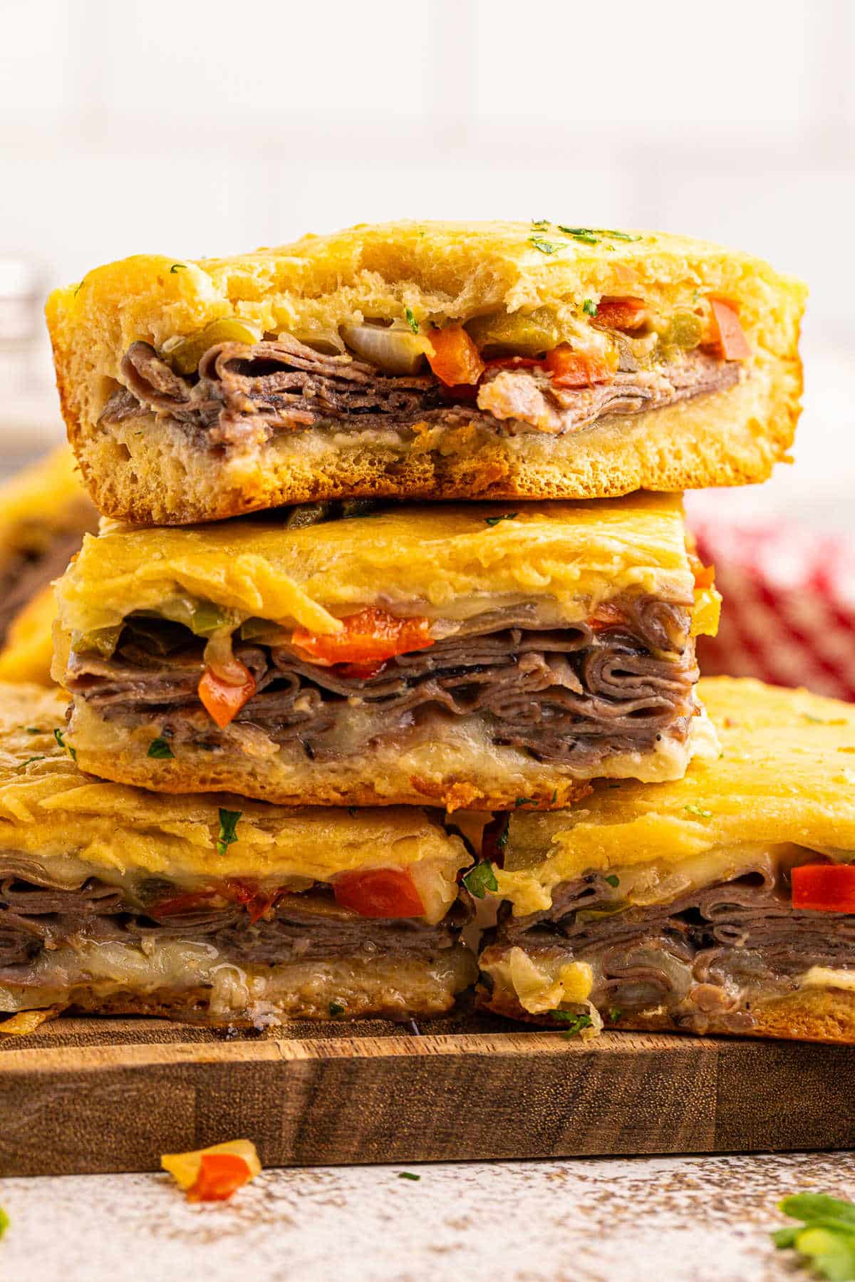 A stack of Philly cheesesteak squares.