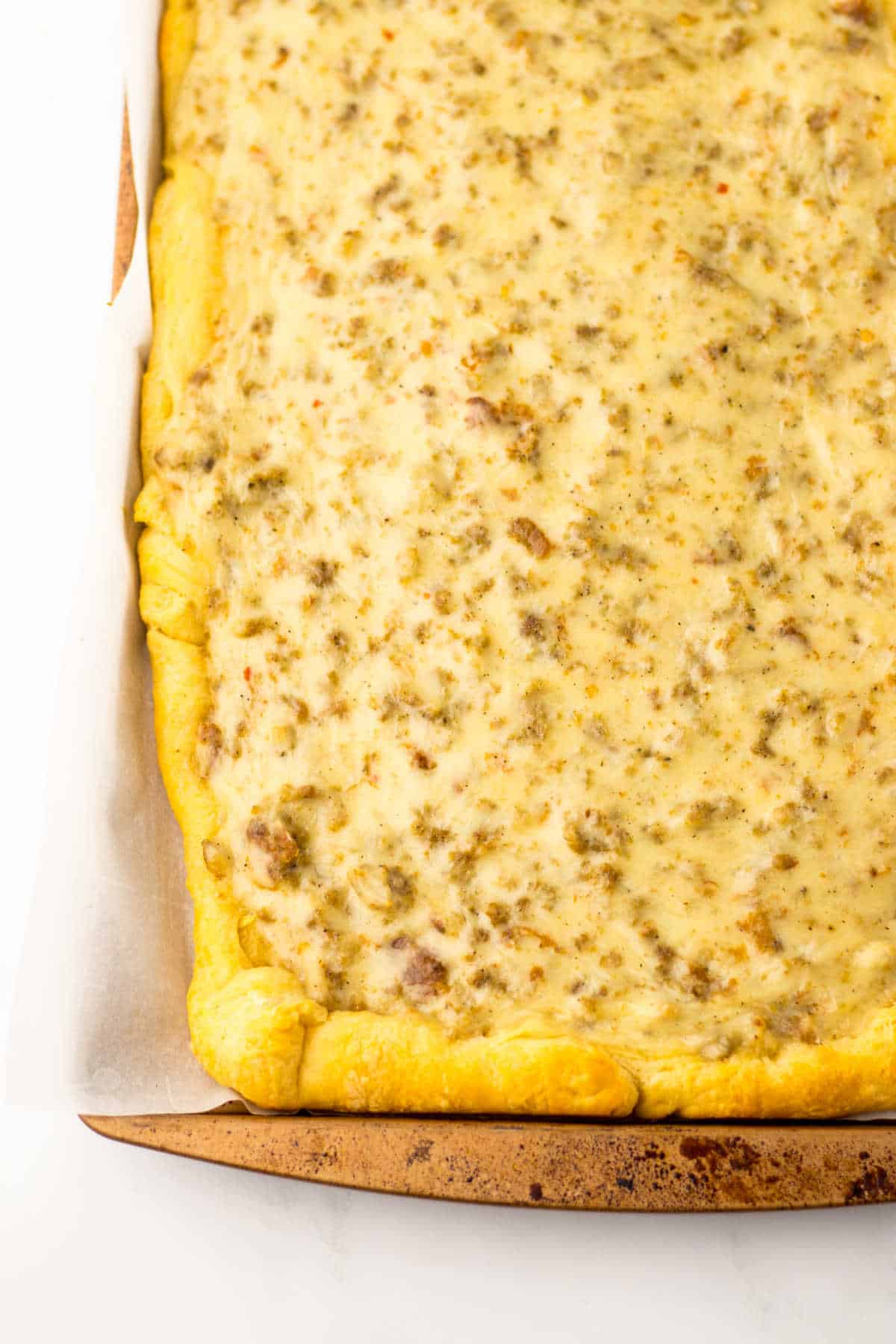 School breakfast pizza on a sheet pan.