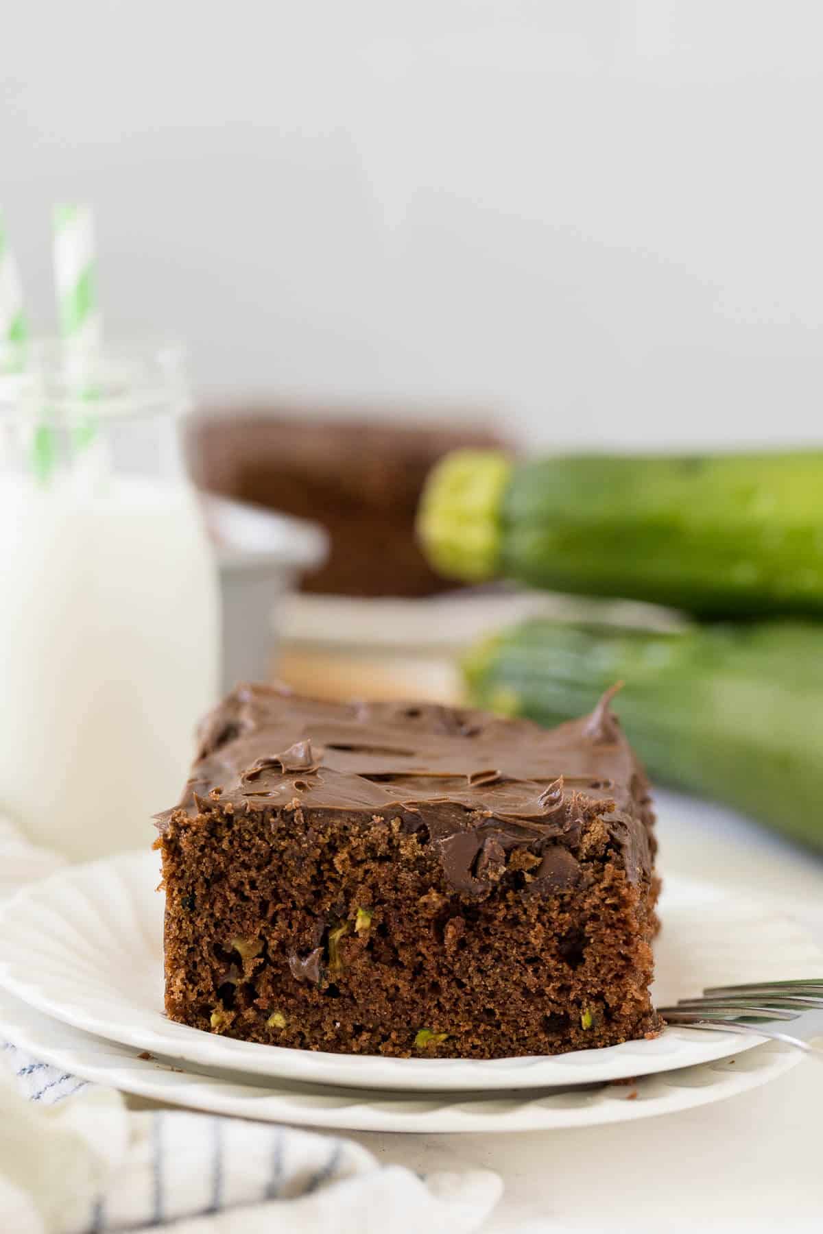 Chocolate zucchini cake slice on a plate.