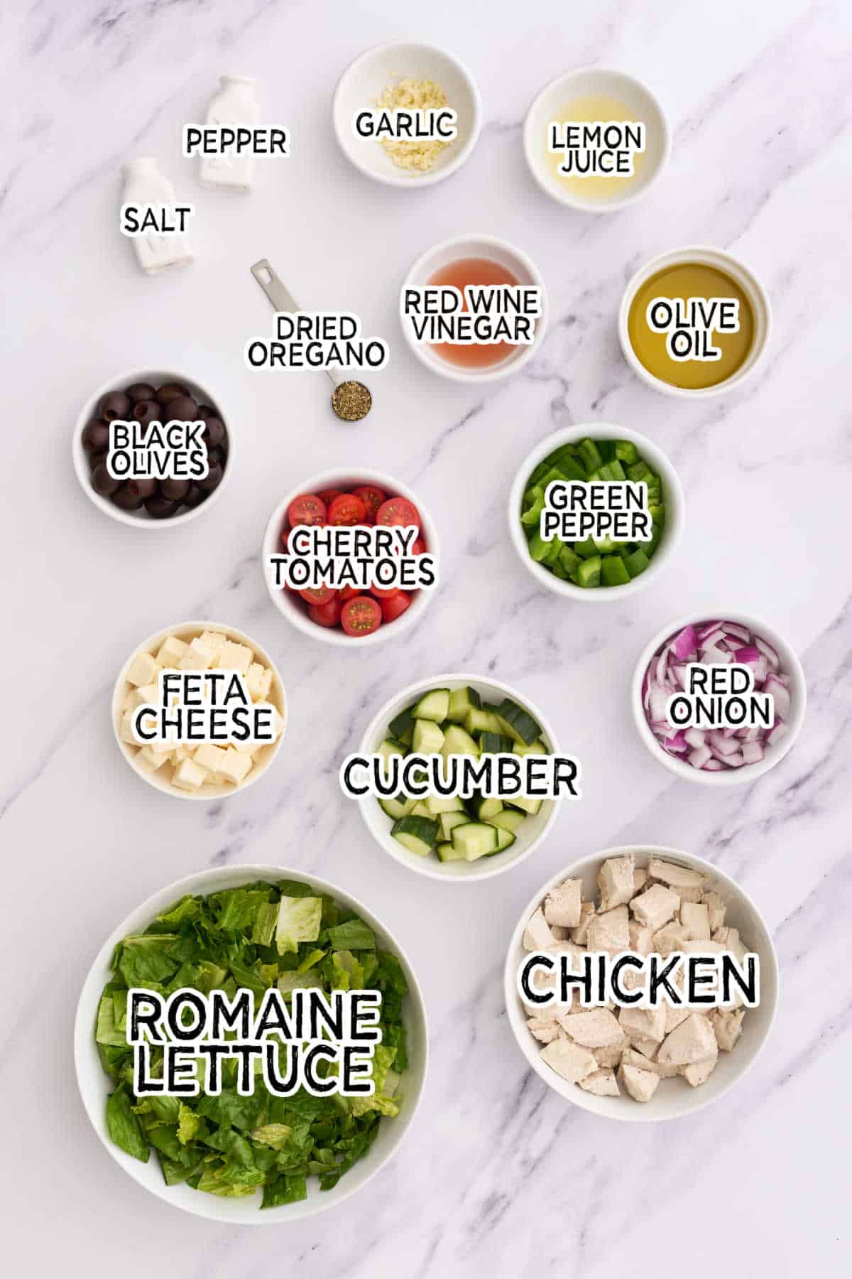 Ingredients to make the salad on a white counter.