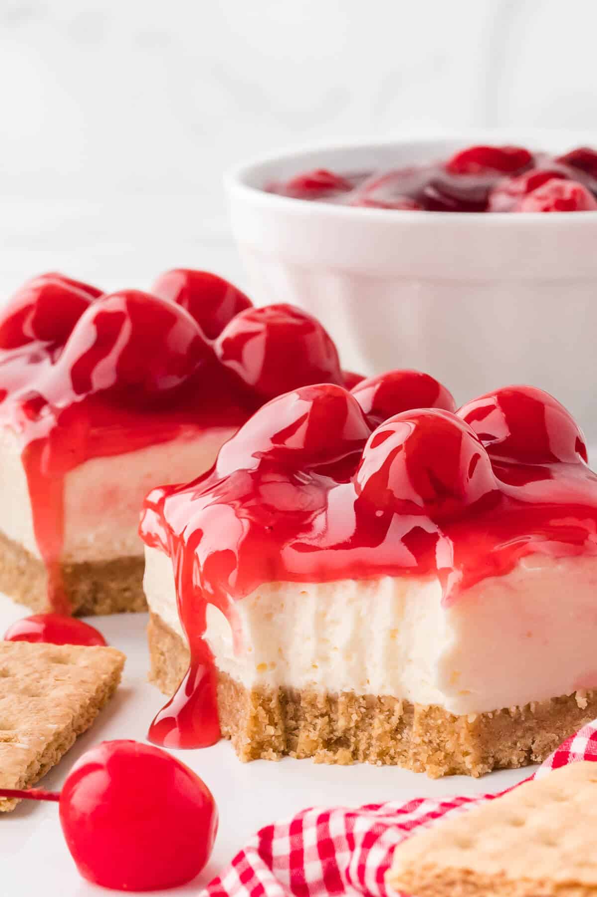 A slice of cheesecake with a bite out of it.