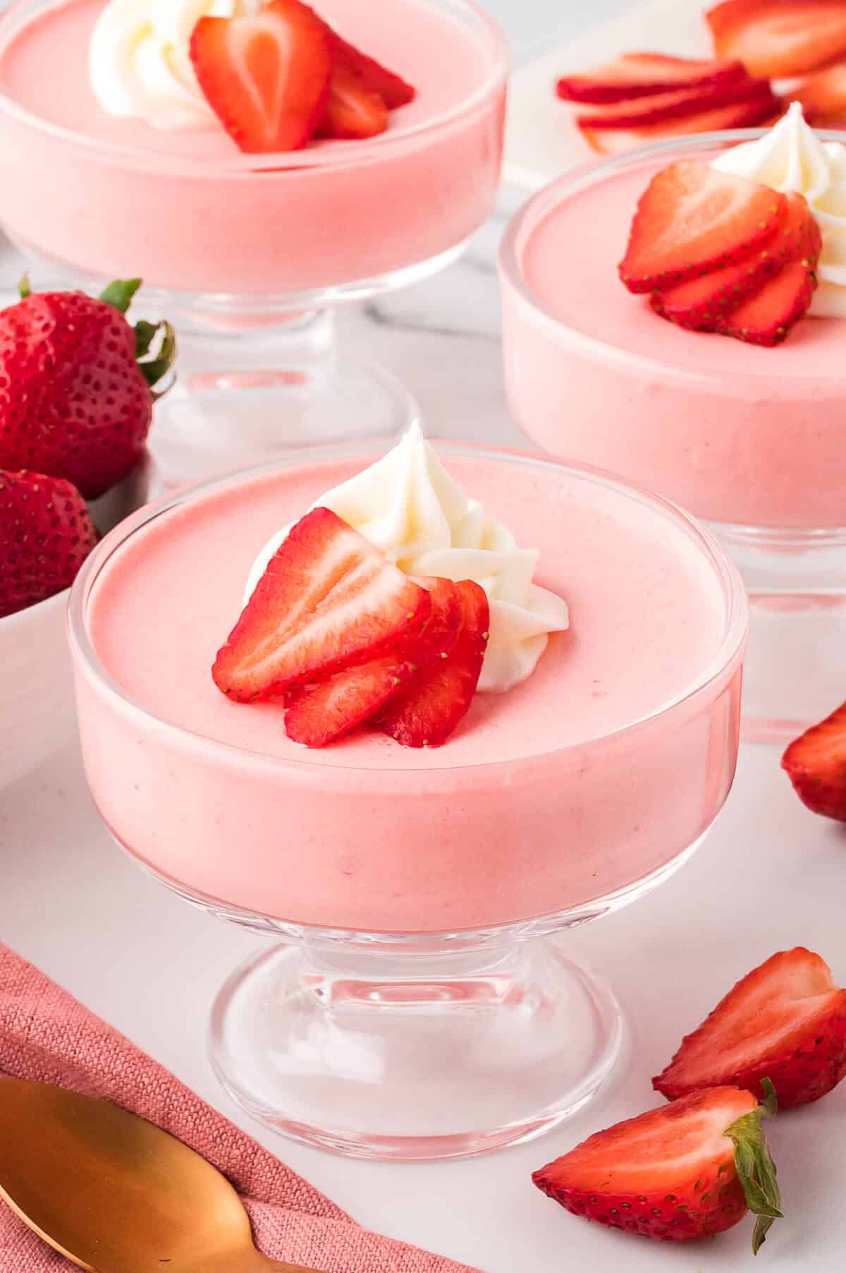 Strawberry mousse in a parfait dish.