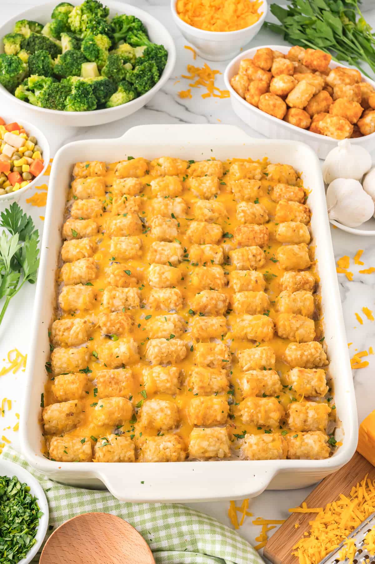 Tater tot casserole in a white dish.