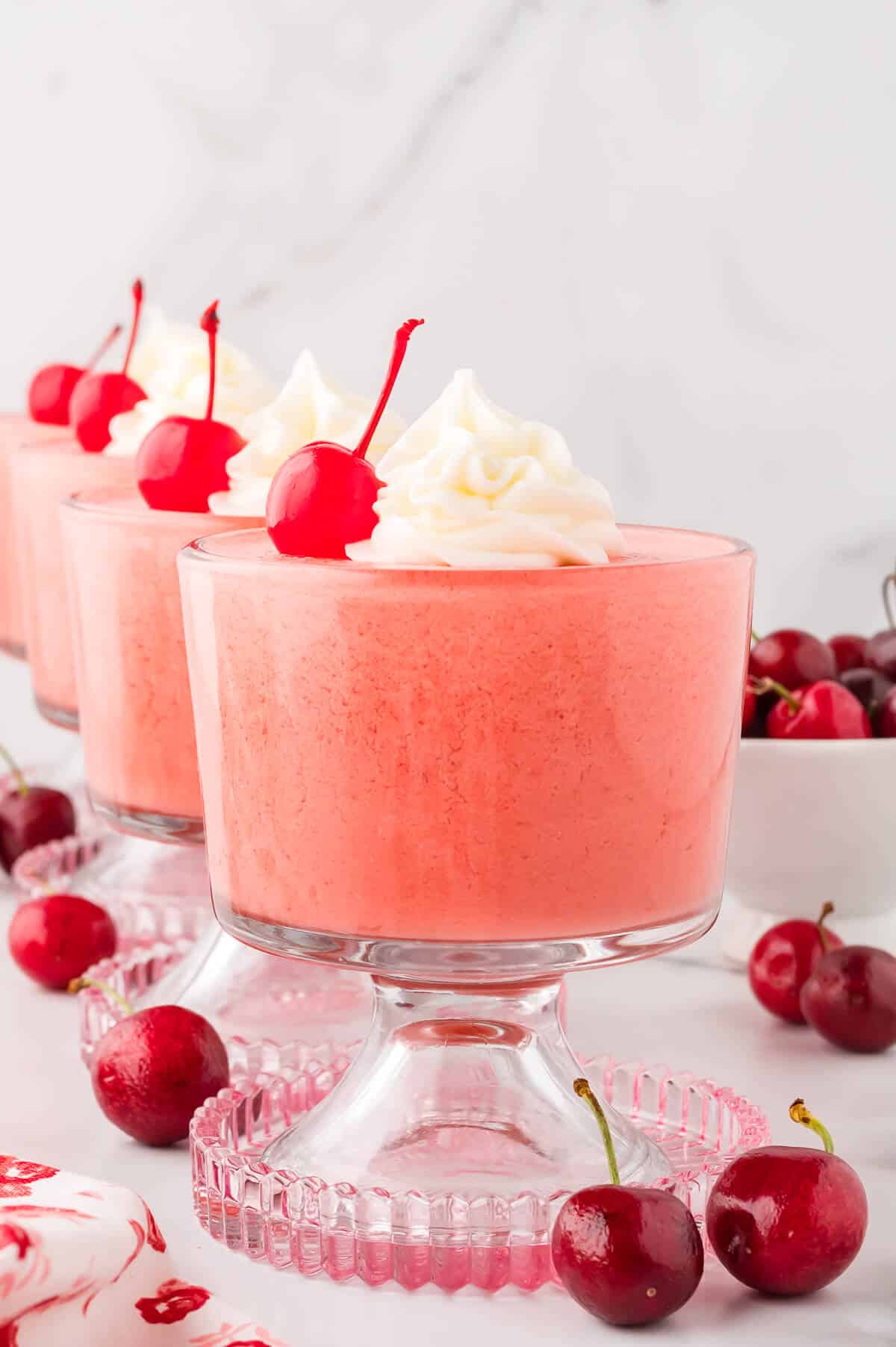Cherry mousse in a parfait dish.