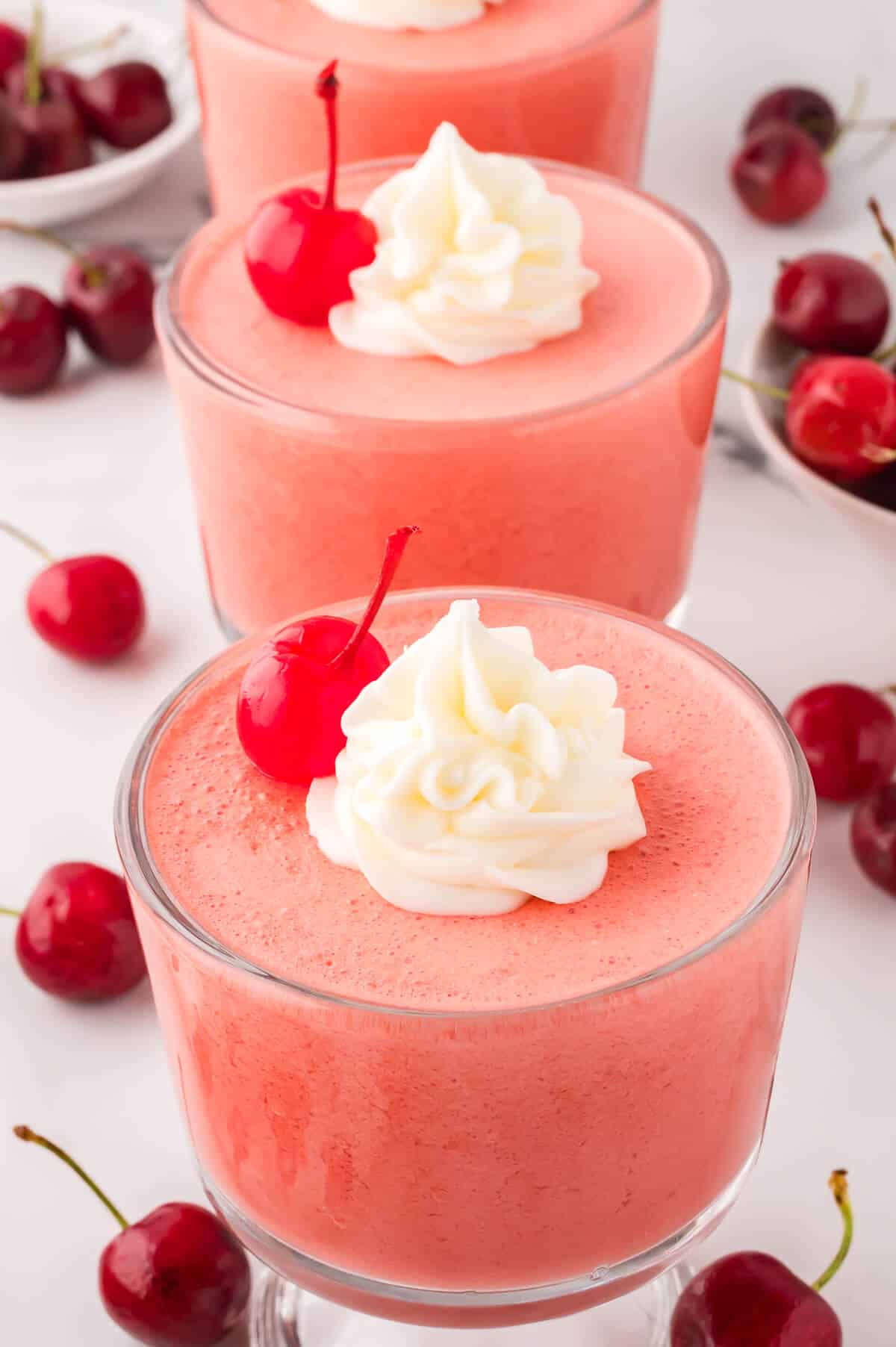 Cherry mousse in a parfait dish.