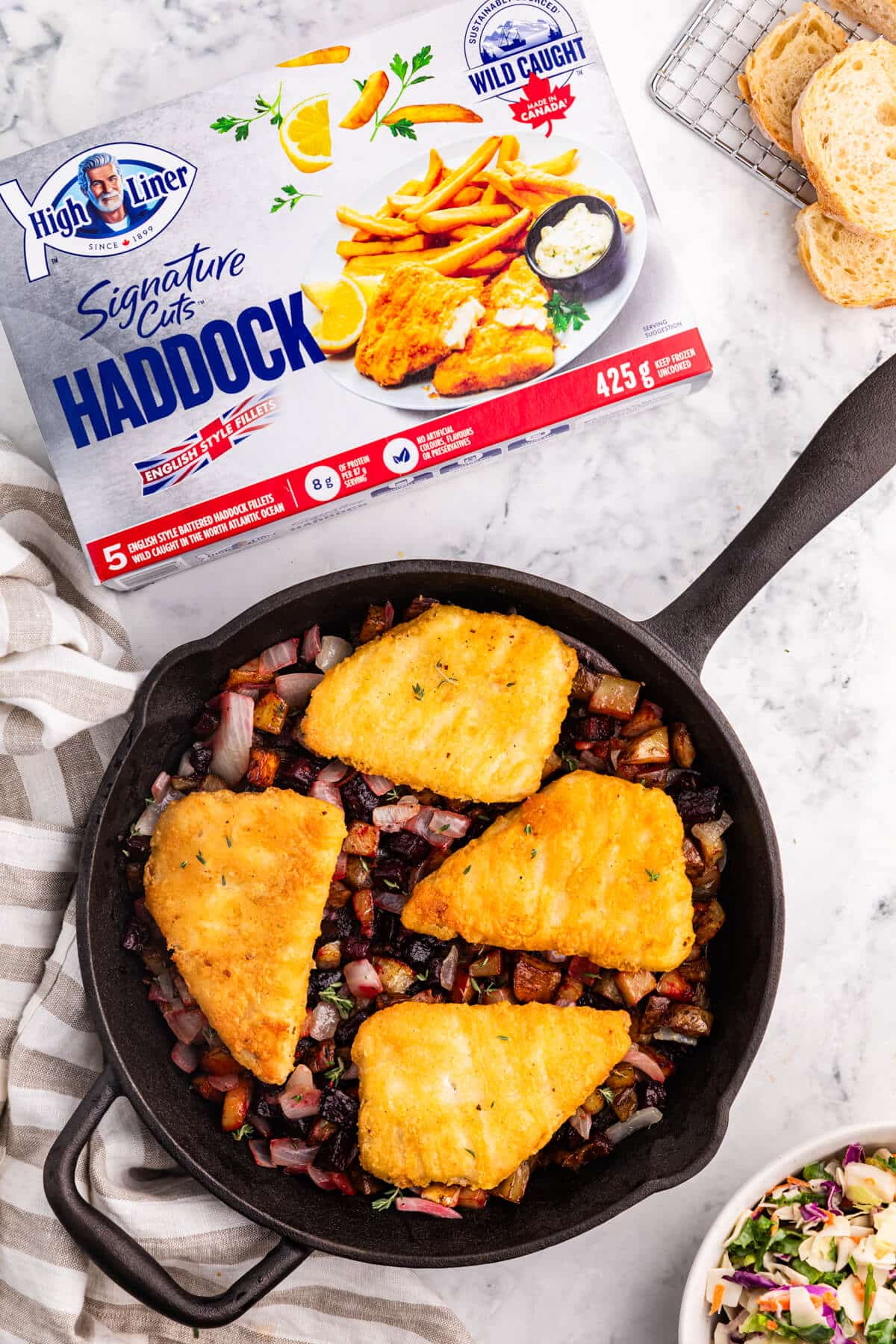 Fish with beet and potato has in a pan.