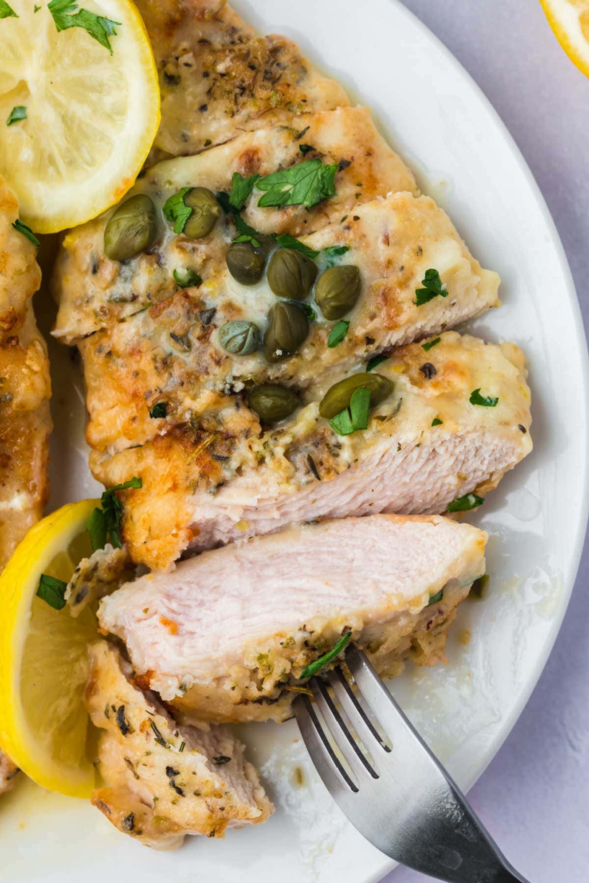 Sliced chicken breast on a plate.