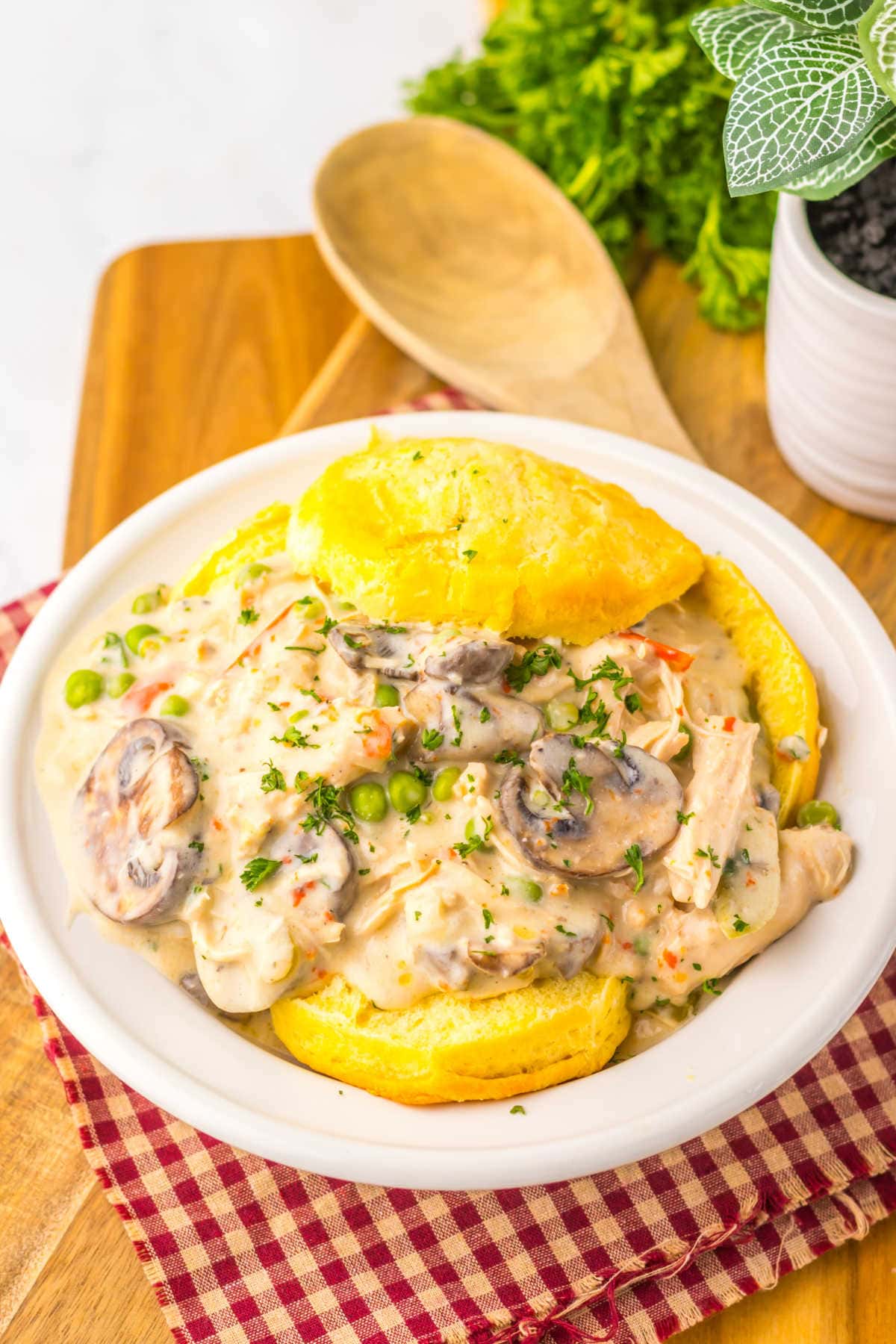 The recipe over biscuits on a plate.