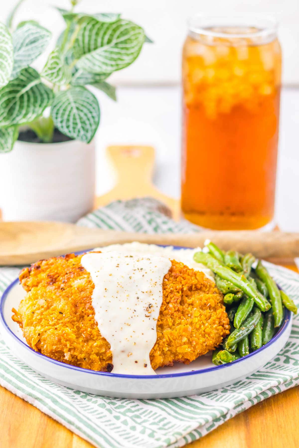 Cracker Barrel Chicken Fried Steak on a plate with green beans.