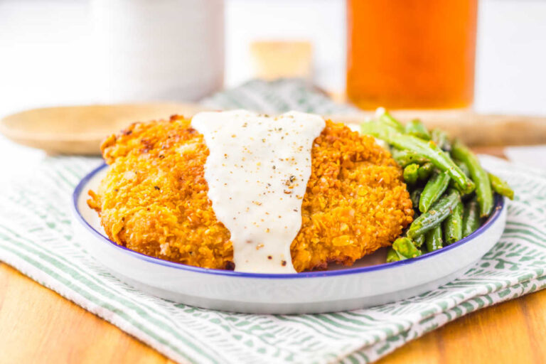 The recipe on a plate with green beans.