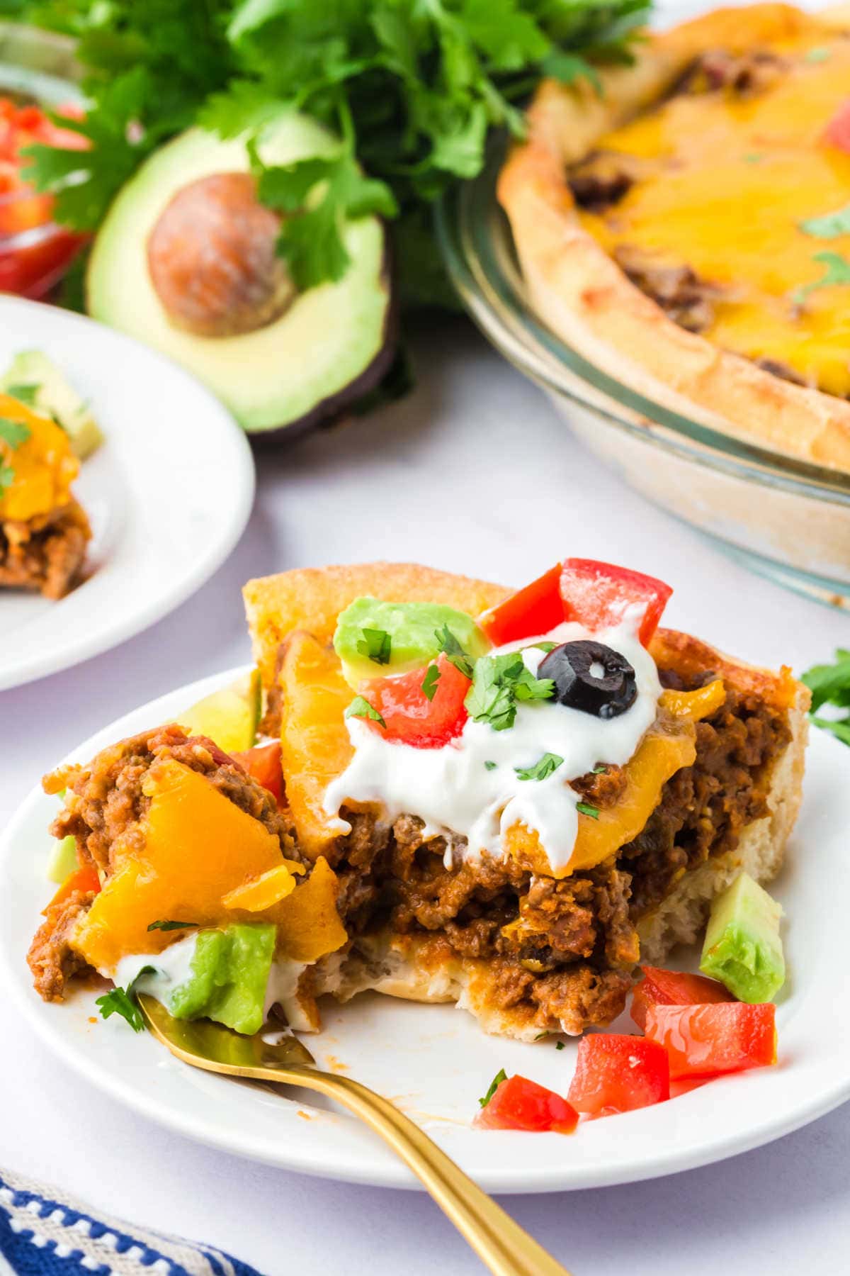 A slice of the recipe on a plate with a fork.