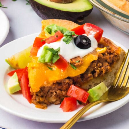 A slice of the recipe on a plate with a fork.