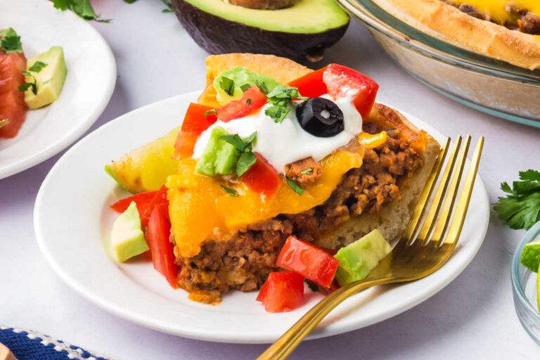 A slice of the recipe on a plate with a fork.
