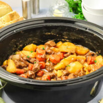The recipe in a black slow cooker.
