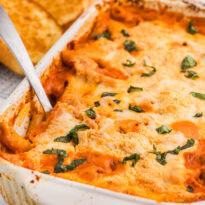 The recipe in a pan with a serving spoon in it.