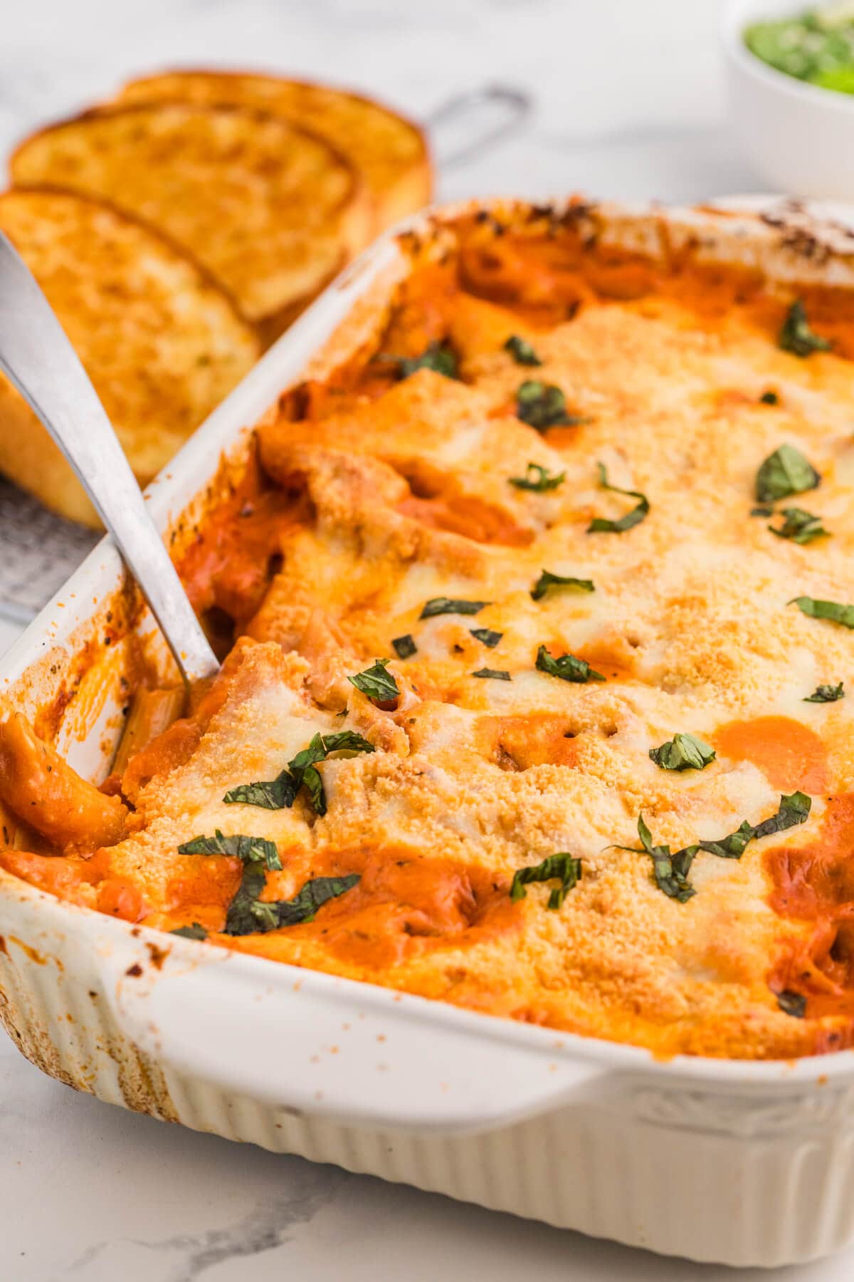 The recipe in a pan with a serving spoon.