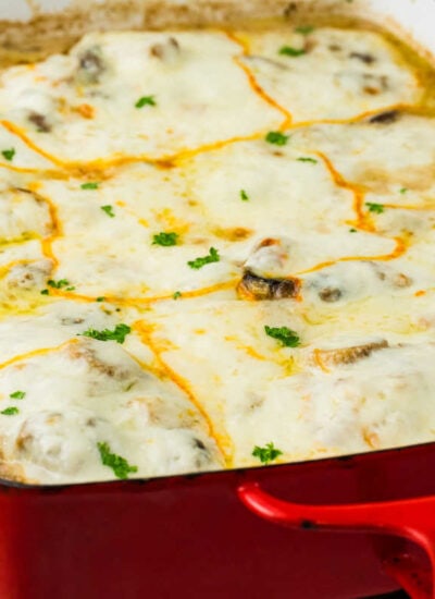 The recipe in a red casserole pan.