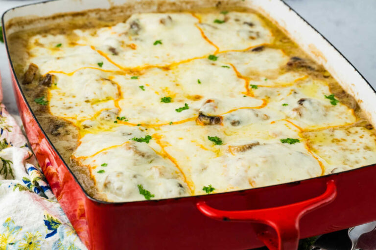 The recipe in a red casserole pan.