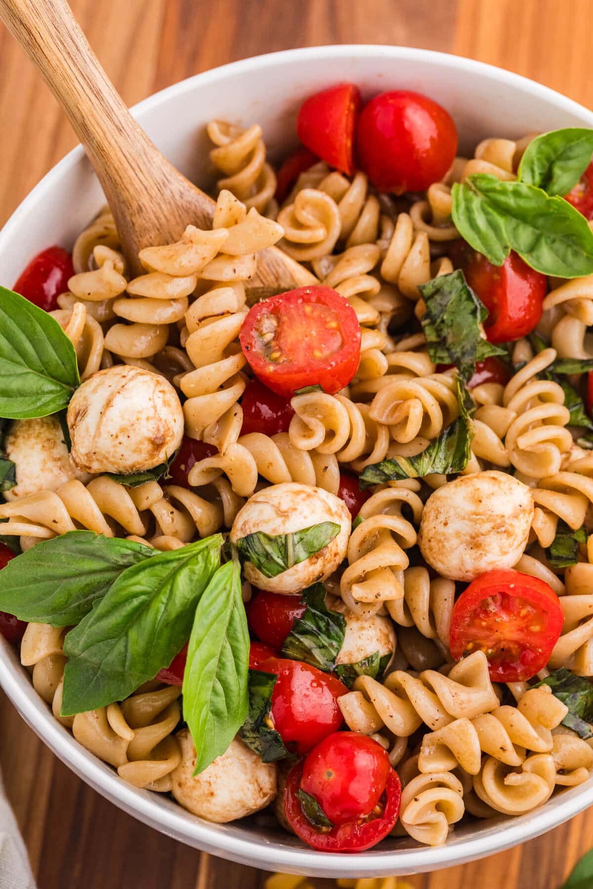 The recipe in a bowl with a wooden spoon.