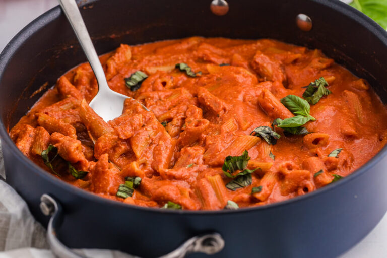 The recipe in a skillet with a serving spoon.