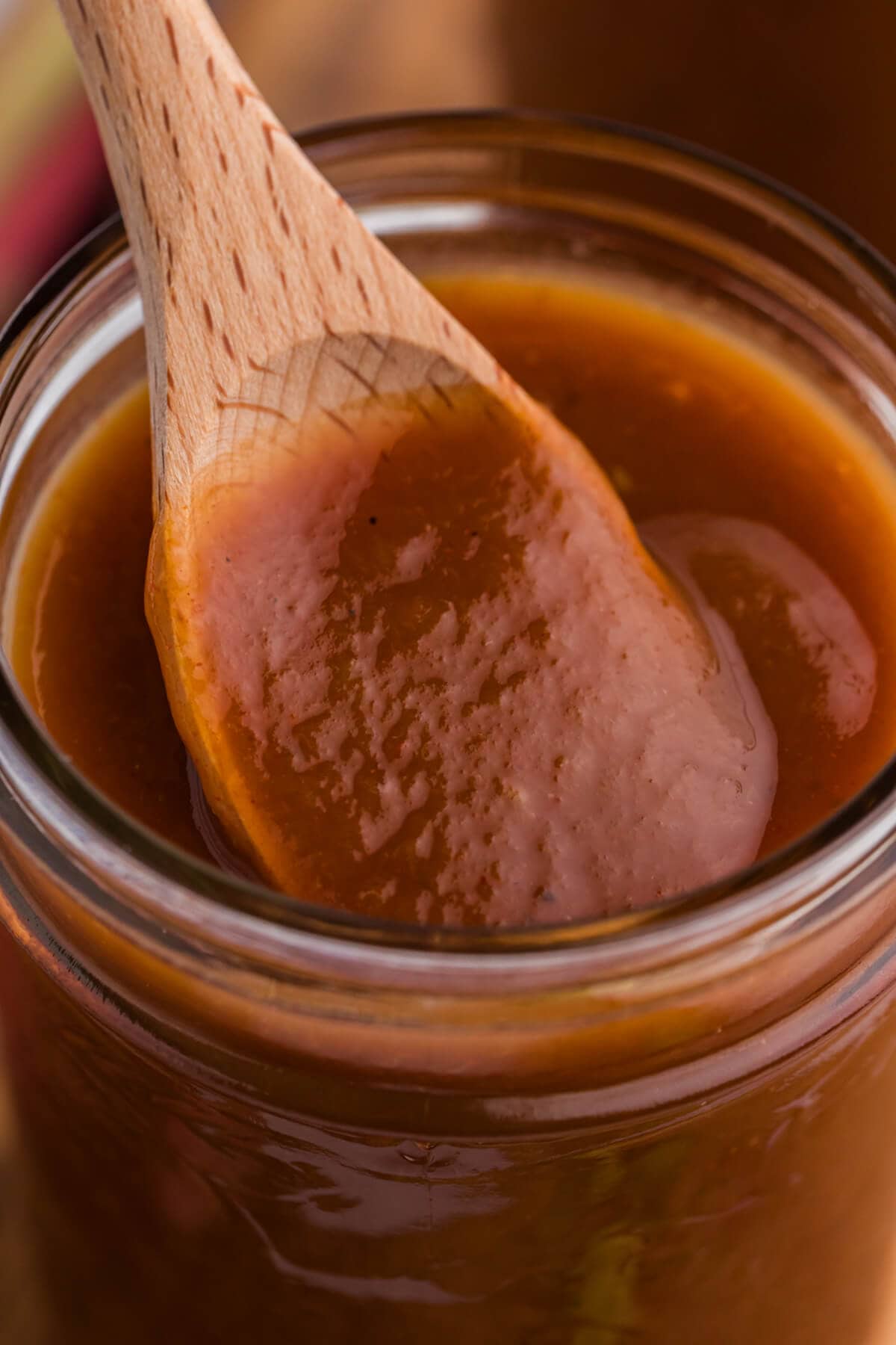 The recipe on a wooden spoon in a jar.