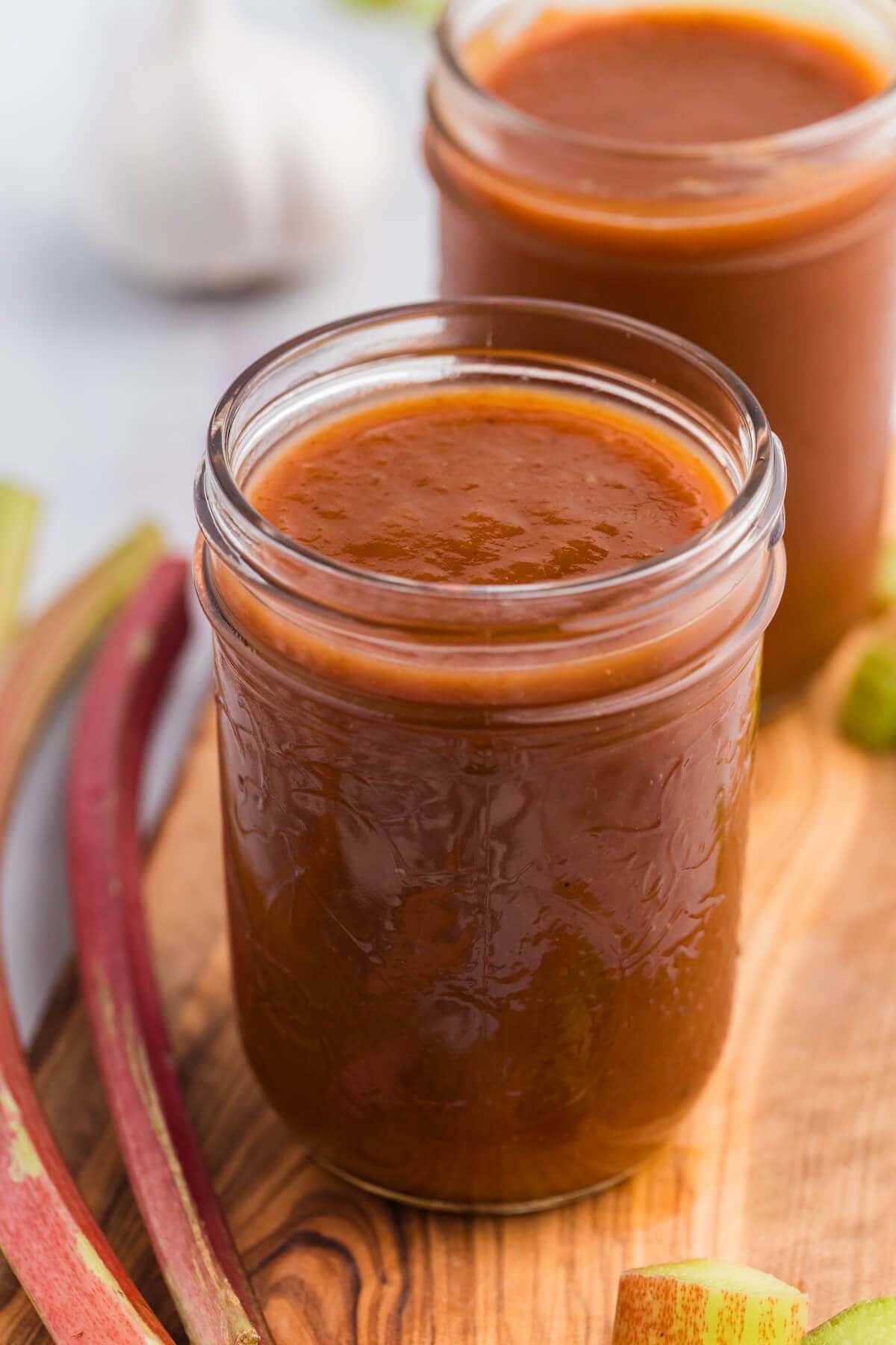 The recipe in a jar on wooden cutting board.