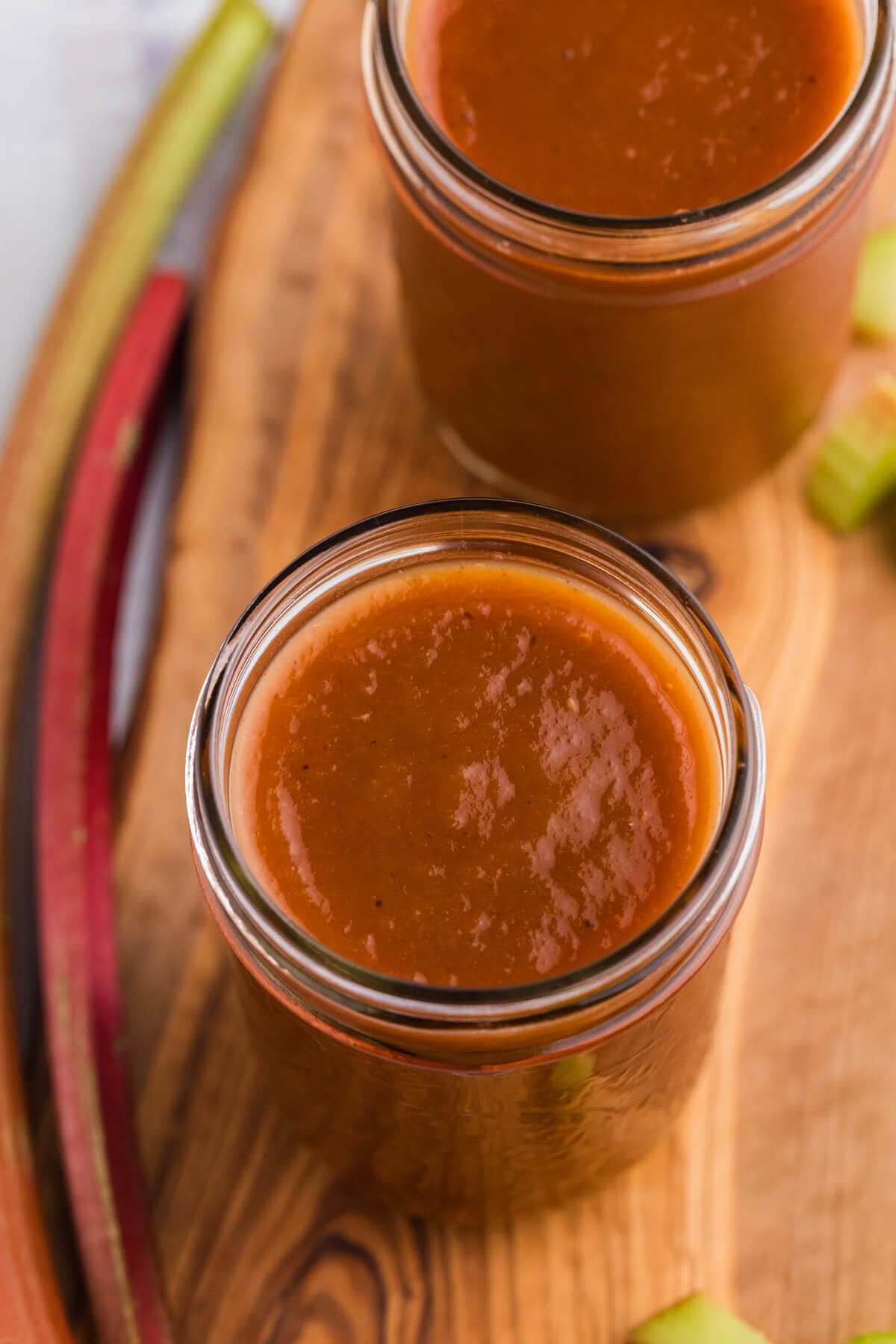 The recipe in glass jars on a wooden cutting board.
