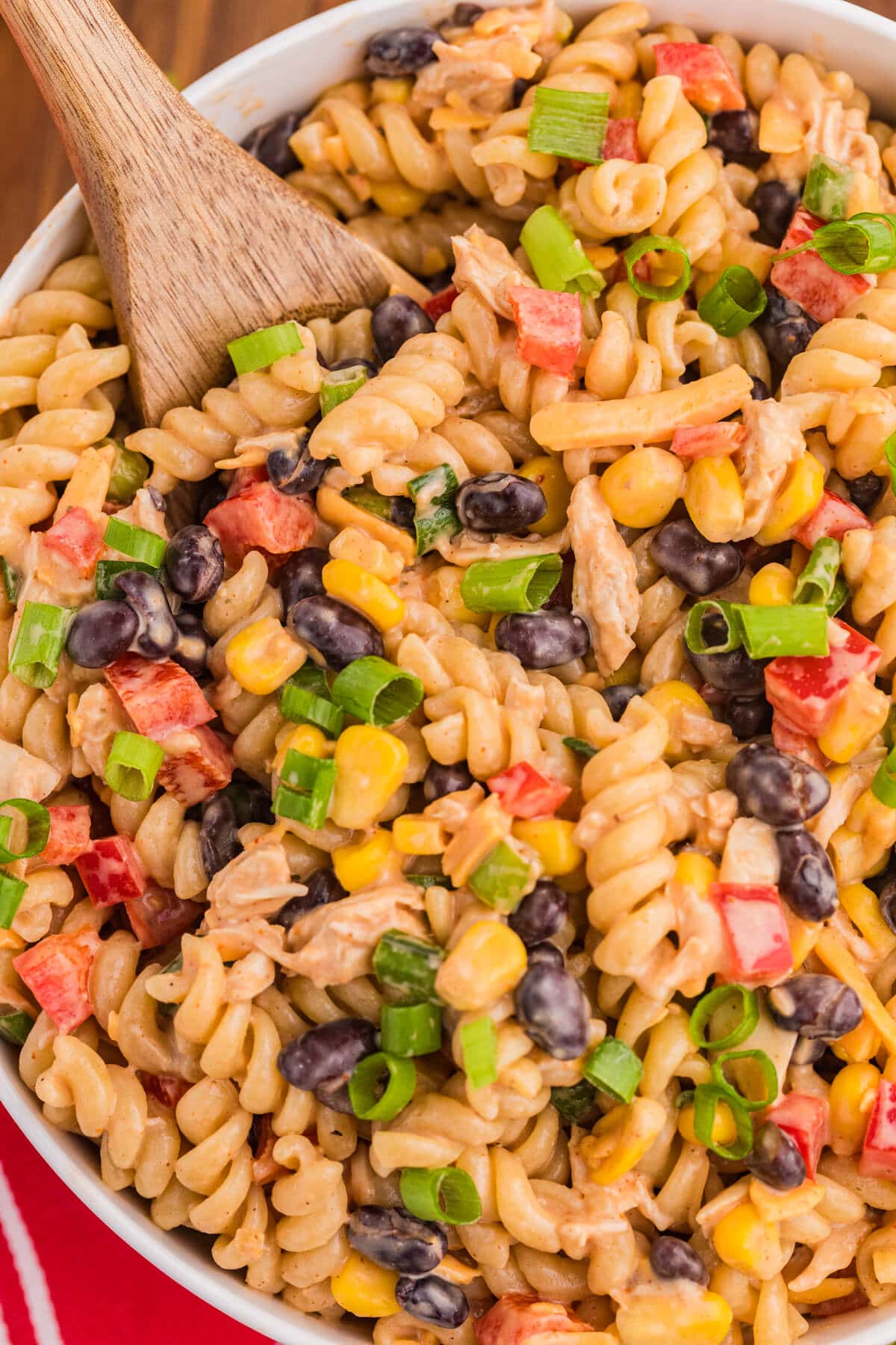 The recipe in a bowl with a wooden spoon.
