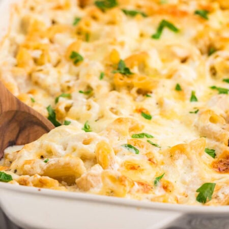 The recipe in a pan with a wooden spoon.